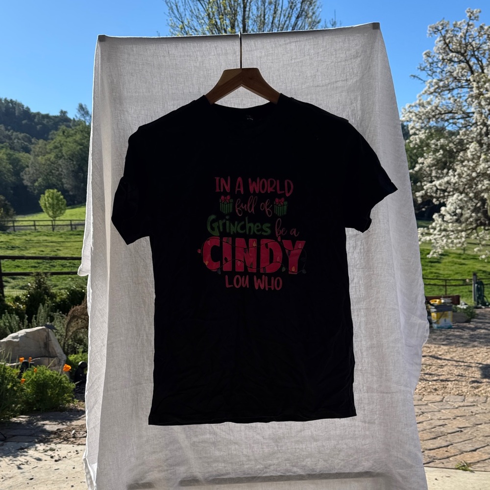 Black Graphic Tee - "In a World Full of Grinches Be a Cindy Lou Who"
